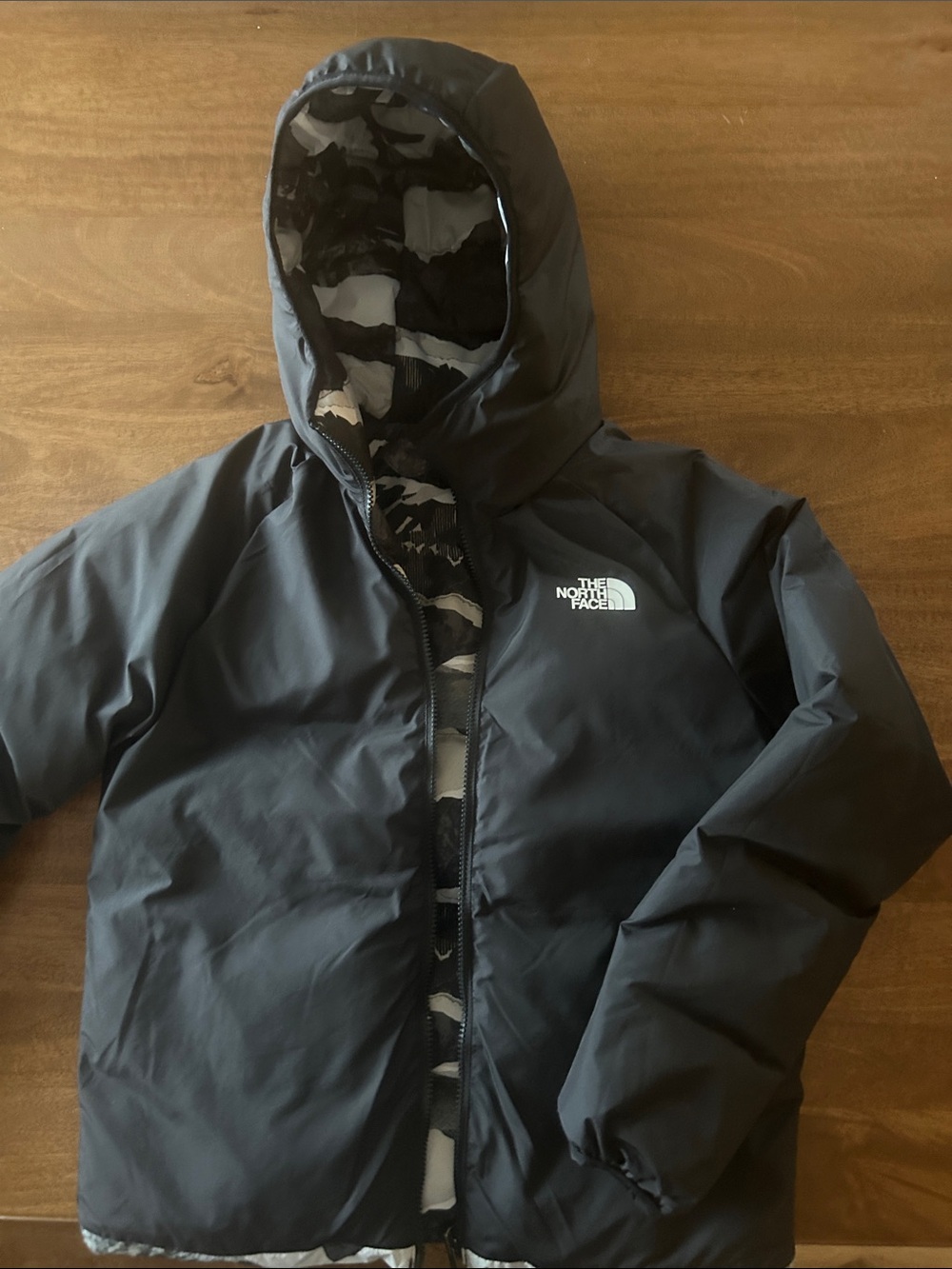 The North Face Kids Black Hooded Puffer Jacket with Camo Lining